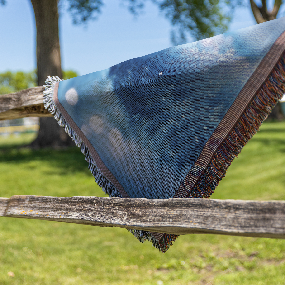 Serene_Winter_Snowflake_Woven_Throw_Blan_Fence_H_Mockup.png
