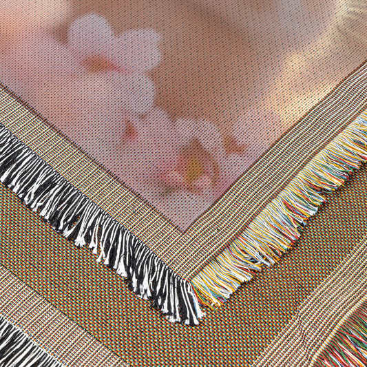 Baby Rabbits Playing Under Glowing Cherry Blossom Tree Woven Throw Blanket with Pink Petals and Soft Golden Light - Awakening Righteousness