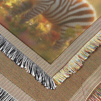 Baby Zebra with Mother in Lush Green Field Surrounded by Blooming Flowers and Soft Sunlight Woven Throw Blanket - Awakening Righteousness