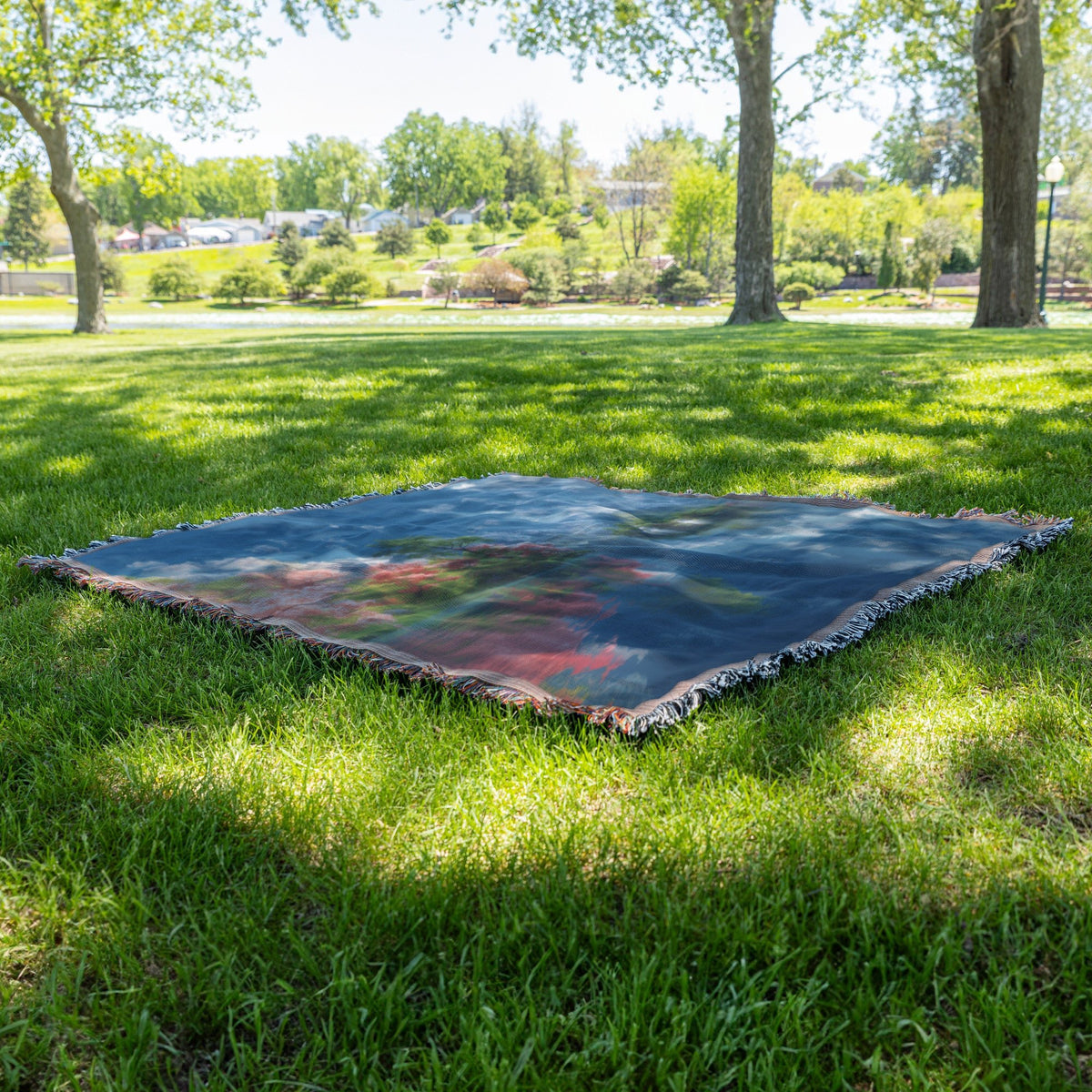 Serene Mountain Lake with Blooming Trees Woven Throw Blanket - Awakening Righteousness